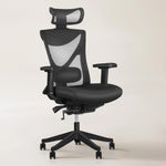 Kai ergonomic office chair in black mesh with adjustable lumbar support, designed for compact home offices